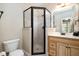 Bathroom featuring a black framed glass shower, a toilet and vanity with a sink at 502 Sippihaw Oaks Dr, Fuquay Varina, NC 27526