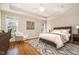 The main bedroom is spacious, includes a ceiling fan and features natural light from windows at 502 Sippihaw Oaks Dr, Fuquay Varina, NC 27526