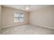 Bedroom with neutral carpet, a window with blinds and a ceiling fan with lighting at 502 Sippihaw Oaks Dr, Fuquay Varina, NC 27526