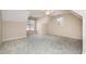 Bedroom featuring neutral carpet, two windows, baseboard trim and a sloped ceiling at 502 Sippihaw Oaks Dr, Fuquay Varina, NC 27526