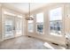 Bright breakfast nook with white trim, tile floors and large windows offering scenic views at 502 Sippihaw Oaks Dr, Fuquay Varina, NC 27526
