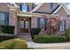 Elegant brick home featuring a beautiful front door with sidelights, and professionally landscaped front yard at 502 Sippihaw Oaks Dr, Fuquay Varina, NC 27526