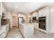 Spacious kitchen features tile floors, stainless appliances, large island, and white cabinetry at 502 Sippihaw Oaks Dr, Fuquay Varina, NC 27526