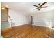 Bright living room featuring hardwood floors, stairs, and an arched entryway, creating a welcoming atmosphere at 502 Sippihaw Oaks Dr, Fuquay Varina, NC 27526