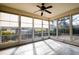 The sunroom is filled with sunlight, has tile floors, and many windows with views of the outdoors at 502 Sippihaw Oaks Dr, Fuquay Varina, NC 27526
