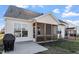 Well-maintained backyard with a screened porch, a patio and a lush lawn at 517 Edenfield Dr, Fuquay Varina, NC 27526