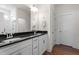 Modern bathroom features dual sinks with granite countertop and framed mirrors at 517 Edenfield Dr, Fuquay Varina, NC 27526