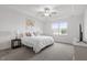 Bright bedroom with tray ceiling, ceiling fan, and large window with natural light at 517 Edenfield Dr, Fuquay Varina, NC 27526