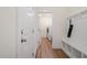 Hallway view to the laundry room with bench seating and coat hooks at 517 Edenfield Dr, Fuquay Varina, NC 27526