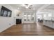 Bright and spacious living area with hardwood floors, fireplace, ample natural light, and an open layout at 517 Edenfield Dr, Fuquay Varina, NC 27526