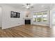 Inviting living space with hardwood floors, fireplace, ample natural light, and an open and airy design at 517 Edenfield Dr, Fuquay Varina, NC 27526