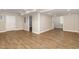 Finished basement featuring durable wood-look flooring and neutral paint at 520 Tall Oaks Dr, Durham, NC 27713