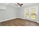 Versatile living space featuring wood-look flooring and French doors leading to outdoor at 520 Tall Oaks Dr, Durham, NC 27713
