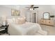 Bright main bedroom with modern decor, neutral colors, and a comfortable queen-sized bed at 520 Tall Oaks Dr, Durham, NC 27713