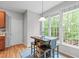 Cozy breakfast nook with natural light, a pendant light, and a view of the trees at 5405 Whisperwood Dr, Durham, NC 27713