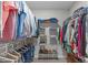 Walk-in closet featuring metal shelving and clothing racks for optimized organization and storage at 5405 Whisperwood Dr, Durham, NC 27713