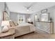 Cozy bedroom with neutral tones, natural light, and a ceiling fan at 55 Northdale Ct, Louisburg, NC 27549