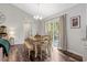Cozy dining area with wood floors and access to the outdoor deck at 55 Northdale Ct, Louisburg, NC 27549