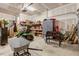 Spacious garage with high ceilings, storage, tools, and outdoor equipment at 55 Northdale Ct, Louisburg, NC 27549