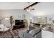 Spacious living room with vaulted ceilings, ceiling fan, and a cozy seating area at 55 Northdale Ct, Louisburg, NC 27549