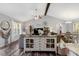 Open concept living room with vaulted ceilings, a dining area, and natural light at 55 Northdale Ct, Louisburg, NC 27549
