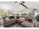 Bright, open living space with modern decor seamlessly connects living, dining, and kitchen areas at 55 Northdale Ct, Louisburg, NC 27549