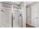 Bright bathroom featuring a large walk-in shower with a glass door and updated fixtures at 55 Northdale Ct, Louisburg, NC 27549