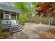 Charming backyard with a screened in porch and stone patio area ready for entertaining at 5900 Orchid Valley Rd, Raleigh, NC 27613