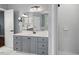 Bright bathroom with a large vanity, shower, and view of closet at 5900 Orchid Valley Rd, Raleigh, NC 27613