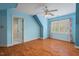 Bedroom boasts hardwood floors and a window with shutters at 5900 Orchid Valley Rd, Raleigh, NC 27613