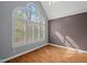 Bright bedroom showcases a large window, providing lots of natural light at 5900 Orchid Valley Rd, Raleigh, NC 27613