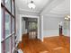 Inviting foyer boasts hardwood floors and elegant trim, showcasing open floor plan at 5900 Orchid Valley Rd, Raleigh, NC 27613