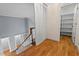 Hallway featuring wood floors, a closet, and a storage area at 5900 Orchid Valley Rd, Raleigh, NC 27613