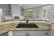 Modern kitchen with granite counters, stainless appliances, and hardwood floors at 5900 Orchid Valley Rd, Raleigh, NC 27613