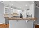 Kitchen features bar top seating and stainless steel appliances at 5900 Orchid Valley Rd, Raleigh, NC 27613