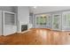 Spacious living room boasts hardwood floors, fireplace, and built-in bookshelves at 5900 Orchid Valley Rd, Raleigh, NC 27613