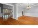 Spacious living room with hardwood floors, wainscoting, and lots of natural light at 5900 Orchid Valley Rd, Raleigh, NC 27613