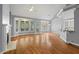 Cozy living area with a fireplace, bar and lots of natural light from a large bay window at 5900 Orchid Valley Rd, Raleigh, NC 27613