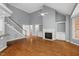 Spacious living room with hardwood floors, fireplace, and built-in shelving at 5900 Orchid Valley Rd, Raleigh, NC 27613
