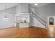 Bright living room with hardwood floors, open layout, and staircase at 5900 Orchid Valley Rd, Raleigh, NC 27613