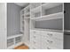 Organized walk-in closet with custom shelving and drawers, maximizing storage space at 5900 Orchid Valley Rd, Raleigh, NC 27613