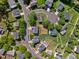 Aerial view of a residential neighborhood featuring tree-lined streets and well-maintained homes at 6102 Coronado Ln, Durham, NC 27713