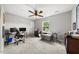 A bedroom featuring carpeted floors, ceiling fan, and a window providing natural light at 6102 Coronado Ln, Durham, NC 27713