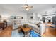 Spacious living room with a large sectional sofa, hardwood floors, and ample natural light at 6102 Coronado Ln, Durham, NC 27713