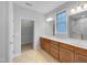 Bathroom featuring a double vanity, tile floors, and a walk-in closet at 611 Atticus Way, Durham, NC 27703