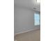 Bedroom with neutral carpet, light gray walls and a window at 611 Atticus Way, Durham, NC 27703