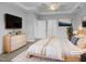 Calming main bedroom suite featuring a tray ceiling and carpet at 611 Atticus Way, Durham, NC 27703