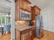 A kitchen with stainless steel appliances, granite countertops, and wood cabinets at 642 Bear Tree Creek, Chapel Hill, NC 27517