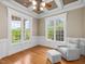 Home office showcasing large windows, wainscoting details, hardwood floors, and natural light at 642 Bear Tree Creek, Chapel Hill, NC 27517