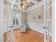 Bright office featuring hardwood floors, large windows, wainscoting, and a decorative ceiling at 642 Bear Tree Creek, Chapel Hill, NC 27517